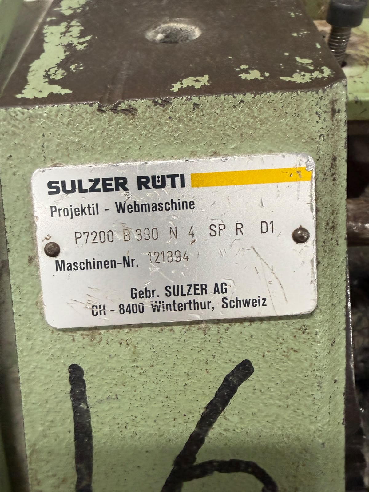 Row of Sulzer Rüti projectile looms with drive wheel